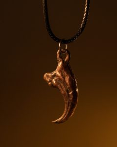Copper Velociraptor claw necklace