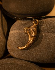 bronze cast velociraptor claw pendant