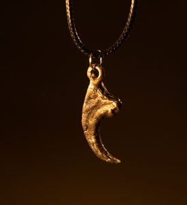 bronze cast velociraptor claw pendant