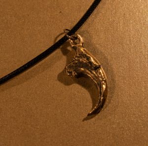 bronze cast velociraptor claw pendant
