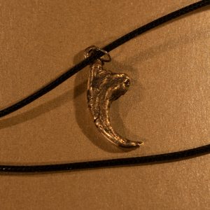 bronze cast velociraptor claw pendant