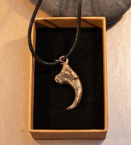 bronze cast velociraptor claw pendant